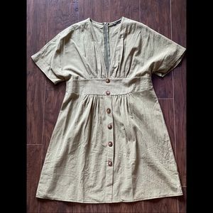 Green short sleeve midi dress.